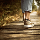 person walking on boardwalk